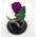фиолетовая роза в стеклянной колбе